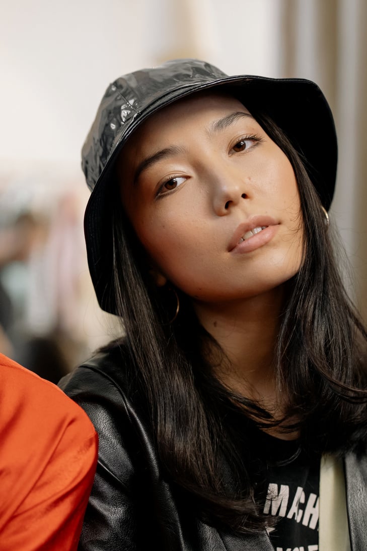 Portrait of a Woman Wearing a Black Bucket Hat